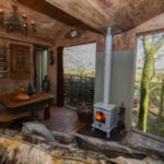 light-the-wood-burner-and-relax-inside-faraway-treehouse-in-cumbria