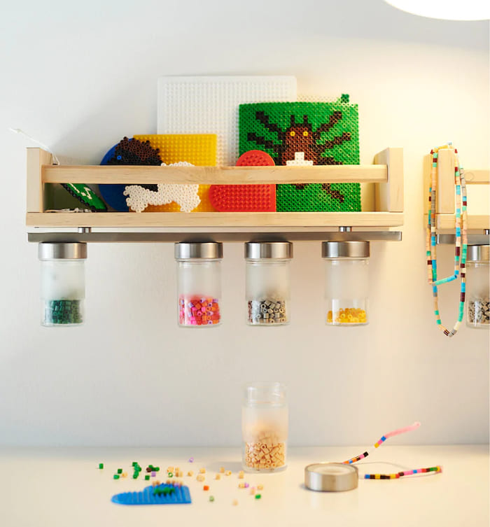 a-small-wooden-shelf-with-a-magnetic-knife-rack-attached-to – 92ba770ec32a2958a033c41317dd309c