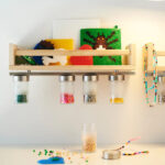 a-small-wooden-shelf-with-a-magnetic-knife-rack-attached-to-92ba770ec32a2958a033c41317dd309c