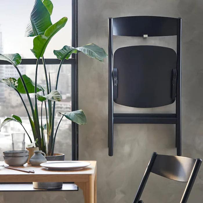 ravaror folding chair black  0922838 PE788253 S5 - 20 Space-Saving Ideas That Put Your Walls to Work