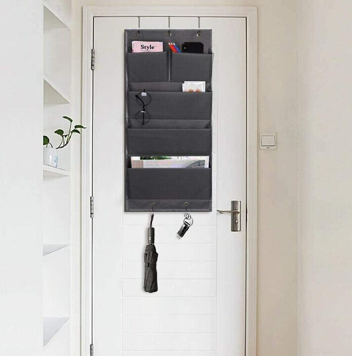 over_door_ironing_board_storage Living in a shoebox