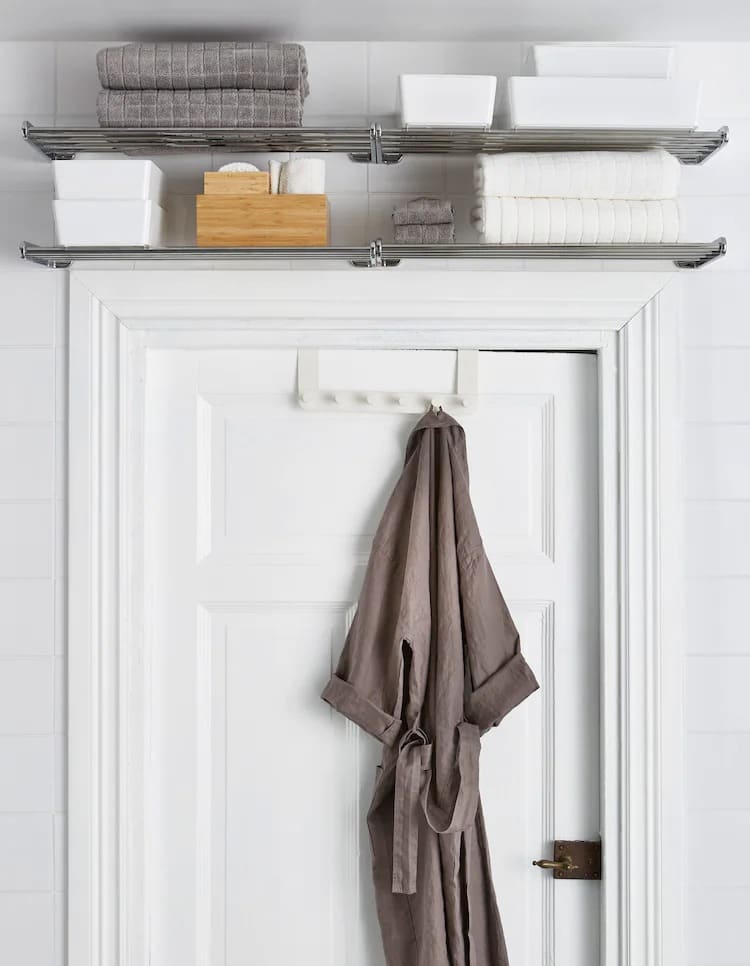 metal shelves are placed above a door frame and store towels 4711017916a3ede9a0a552a8e1ced9bf - 50 Small Bathroom Ideas – Make the Most of Your Tiny Space