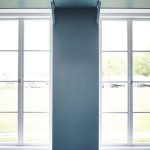 Use the dead space above your windows for storage