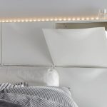 six-white-ikea-trones-shoe-cabinets-are-wall-mounted-to create-headboard