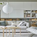 a-bright-living-room-with-an-easy-chair-many-white-wall-moun-04312a8977248021d6287d0f103c7267
