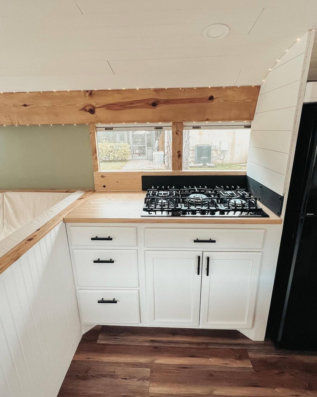 Couple Transforms Old Bus Into Luxurious Tiny Home With PopOut TV in
