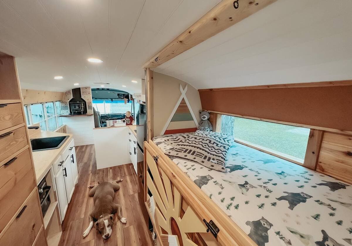 Couple Transforms Old Bus Into Luxurious Tiny Home With PopOut TV in