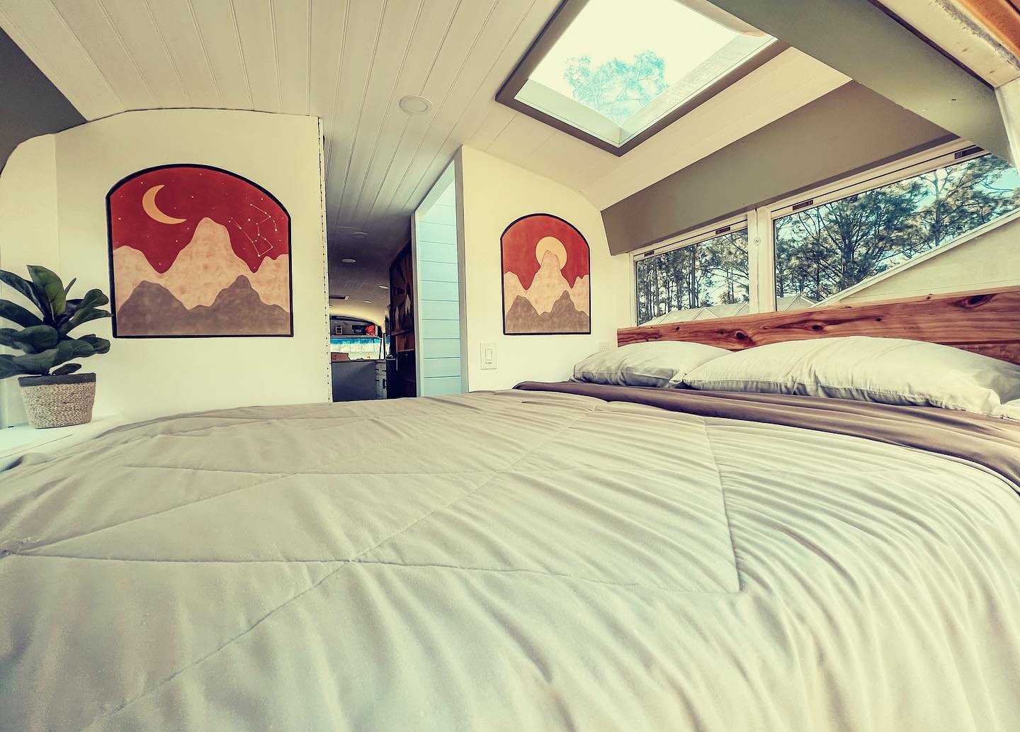 Couple Transforms Old Bus Into Luxurious Tiny Home With PopOut TV in