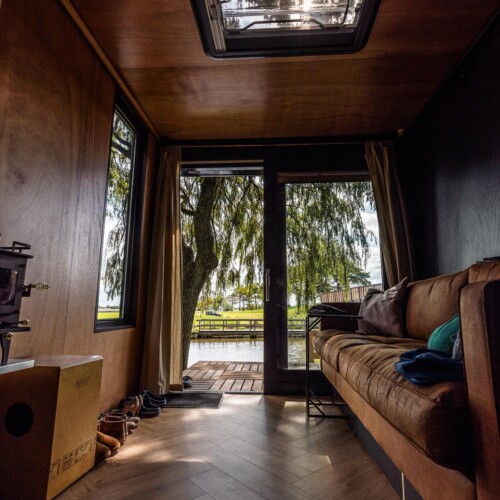 Nomad Couple Converts Used Truck Into Dreamy Tiny Home With Wall