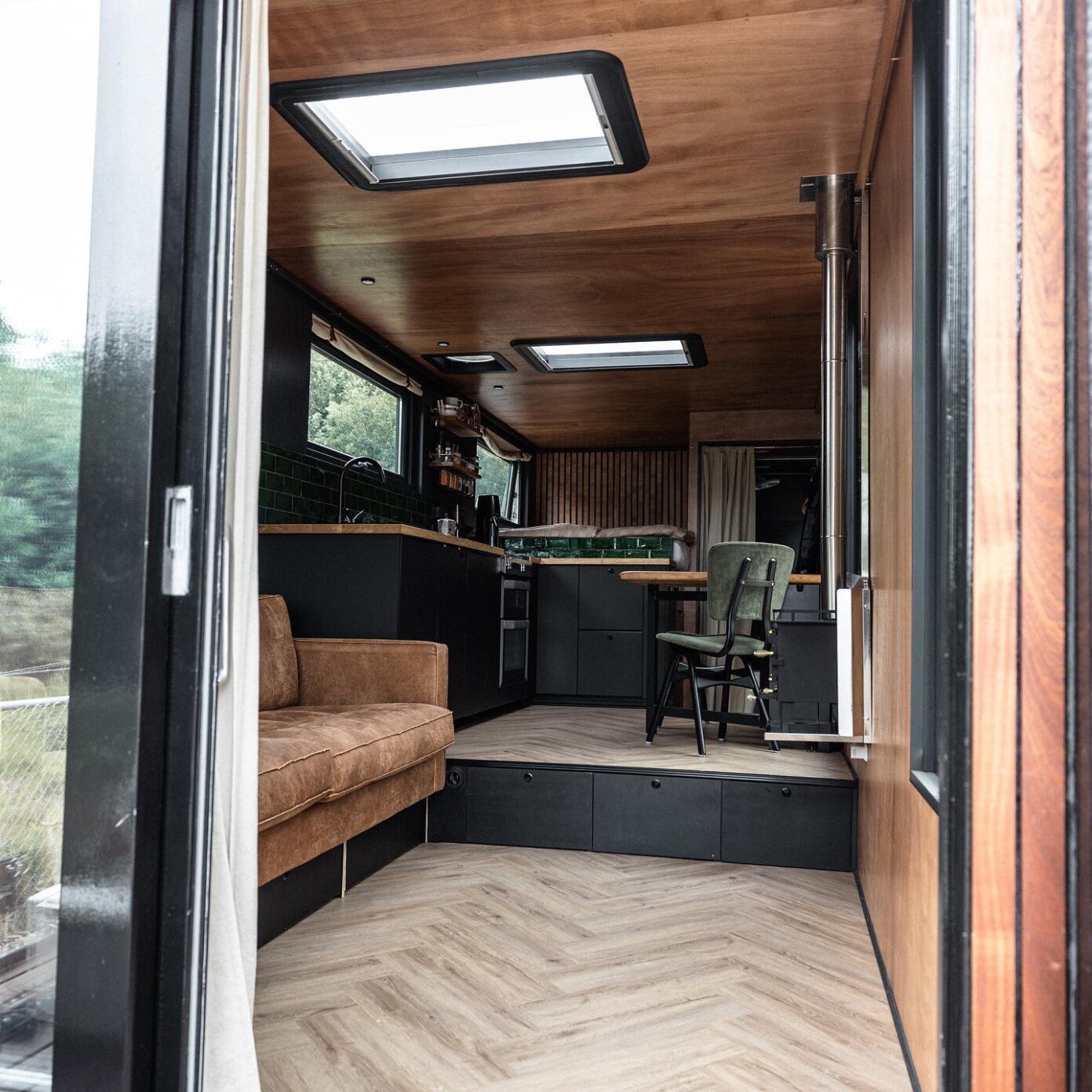 Nomad Couple Converts Used Truck Into Dreamy Tiny Home With Wall