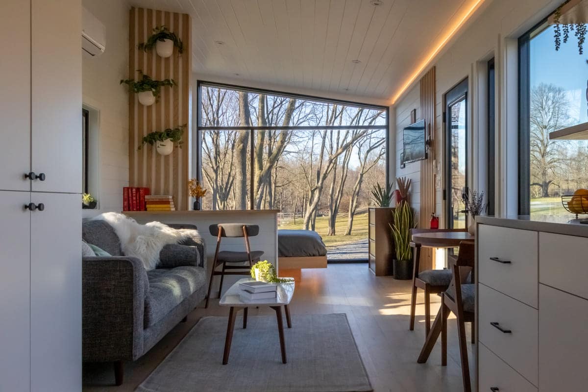 65f9cc9b2af6d2f271d81bf4 10 Luna Daytime 13 1 1 - The One-Level Luna Park Tiny Home Wows with Glass Walls and Sleek Modern Details
