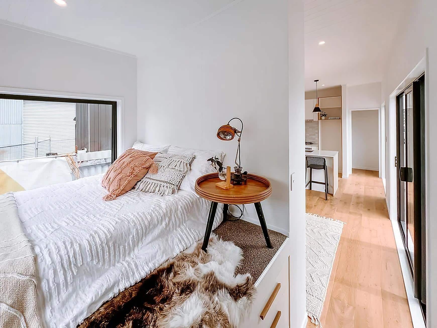 steph shayes tiny homes 10 - A Life Less Lofted: This Sleek Tiny Home Offers Single-Level Living and Clever Hidden Sofas