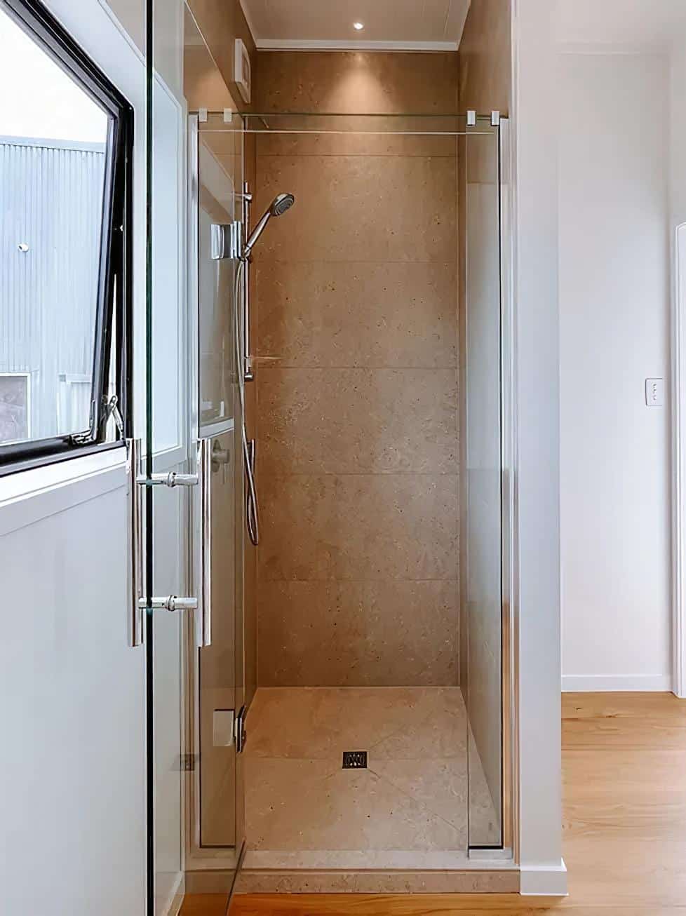steph shayes tiny homes 16 - A Life Less Lofted: This Sleek Tiny Home Offers Single-Level Living and Clever Hidden Sofas