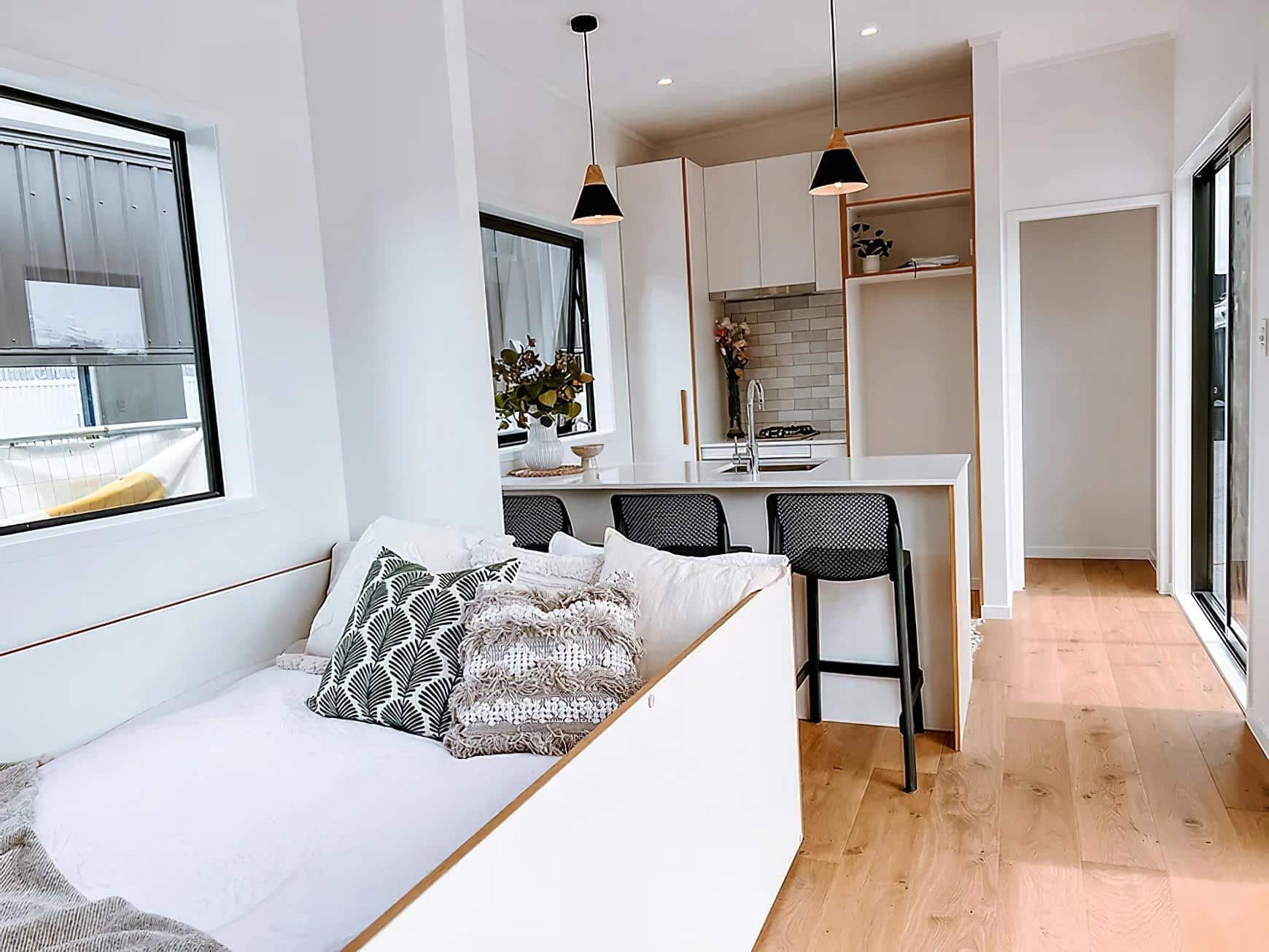 steph shayes tiny homes 6 - A Life Less Lofted: This Sleek Tiny Home Offers Single-Level Living and Clever Hidden Sofas