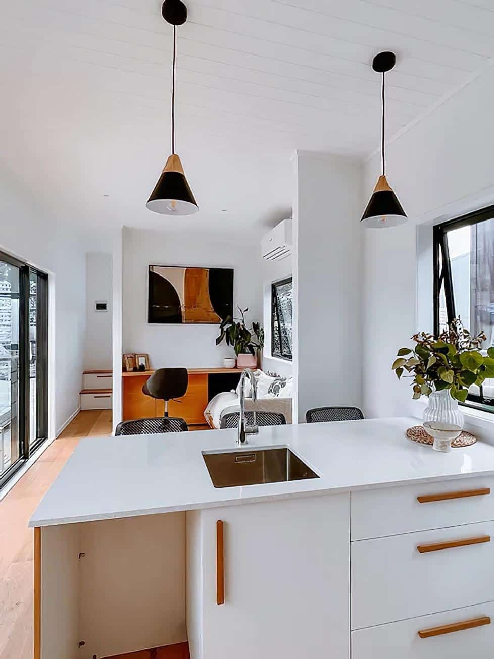 steph shayes tiny homes 7 - A Life Less Lofted: This Sleek Tiny Home Offers Single-Level Living and Clever Hidden Sofas