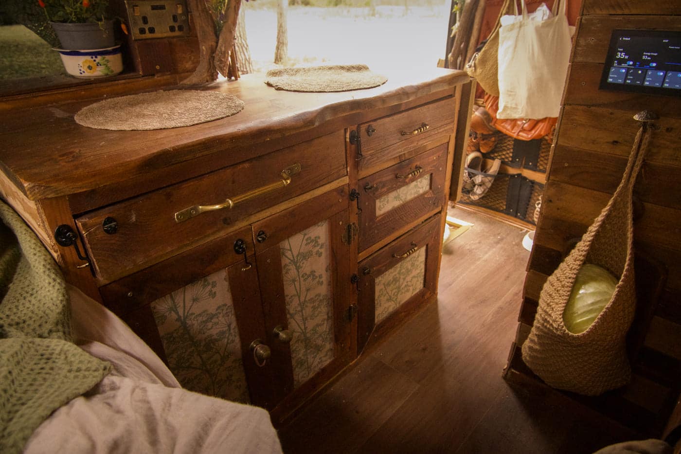 Bilbo kitchen cabinets - Van Life, But Make It Middle-Earth: Meet the Couple Living in a Hobbit-Inspired Home on Wheels