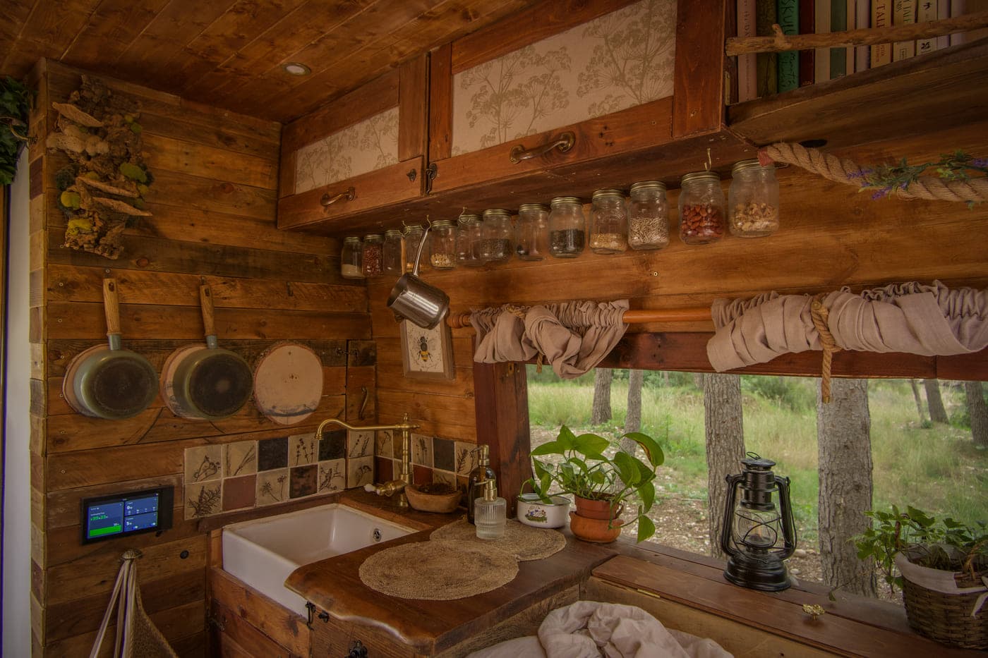 Bilbo kitchen - Van Life, But Make It Middle-Earth: Meet the Couple Living in a Hobbit-Inspired Home on Wheels