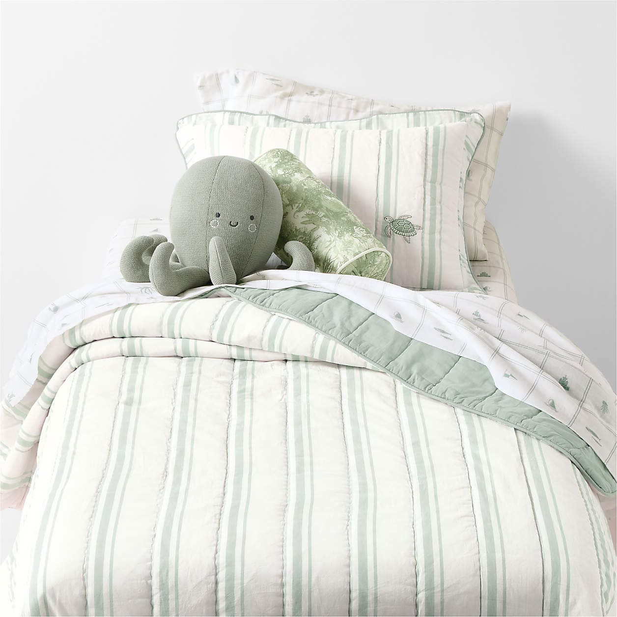Edward Blue Sea Turtle Ticking Stripe Kids Twin Quilt by Jake Arnold - Coastal Charm Meets Old Hollywood in Jake Arnold’s Latest Crate & Barrel Collections