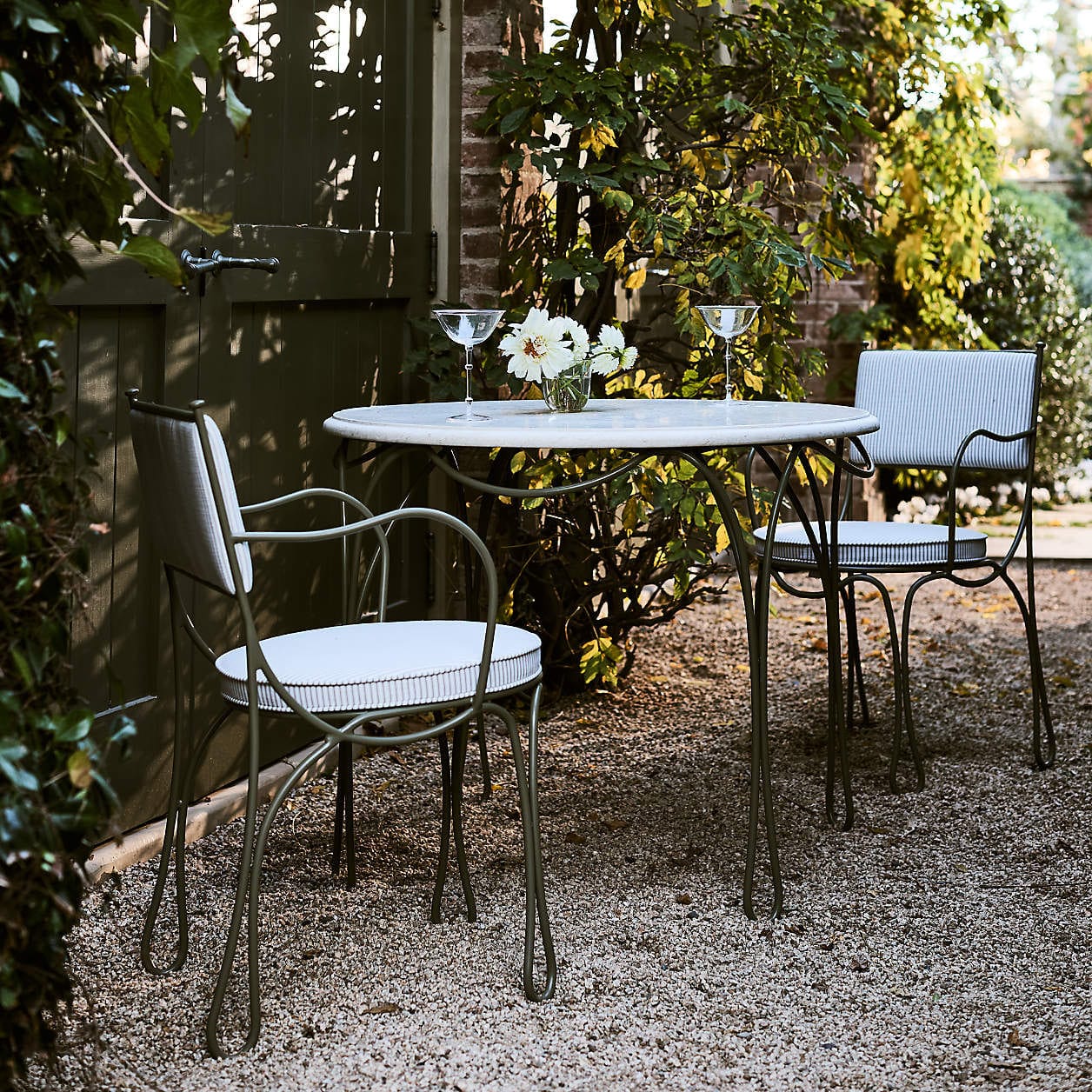 The Harpen Metal Bistro Outdoor Dining Set by Jake Arnold - Coastal Charm Meets Old Hollywood in Jake Arnold’s Latest Crate & Barrel Collections