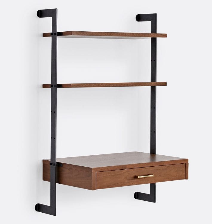 A modern wall-mounted shelving unit with two wooden shelves and a bottom wooden desk drawer, supported by black metal brackets against a white background.